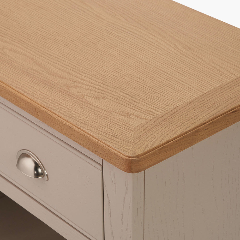 Add timeless country cottage charm to your home with the Fairford 2-Drawer Console Table. Crafted from pine wood with a parchment-white finish and oak-effect top, this elegant table offers practical storage and arrives fully assembled.