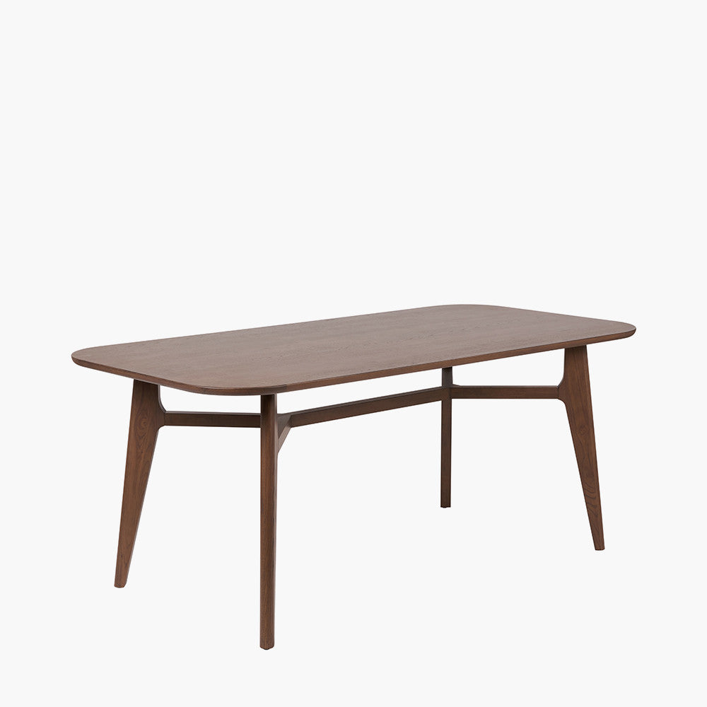 Shop the Elias Dining Table, blending minimalist elegance with Scandinavian-inspired design. Expertly crafted from solid ash wood with a stylish on-trend dark finish. Shop online today at www.nobleandnook.co.uk