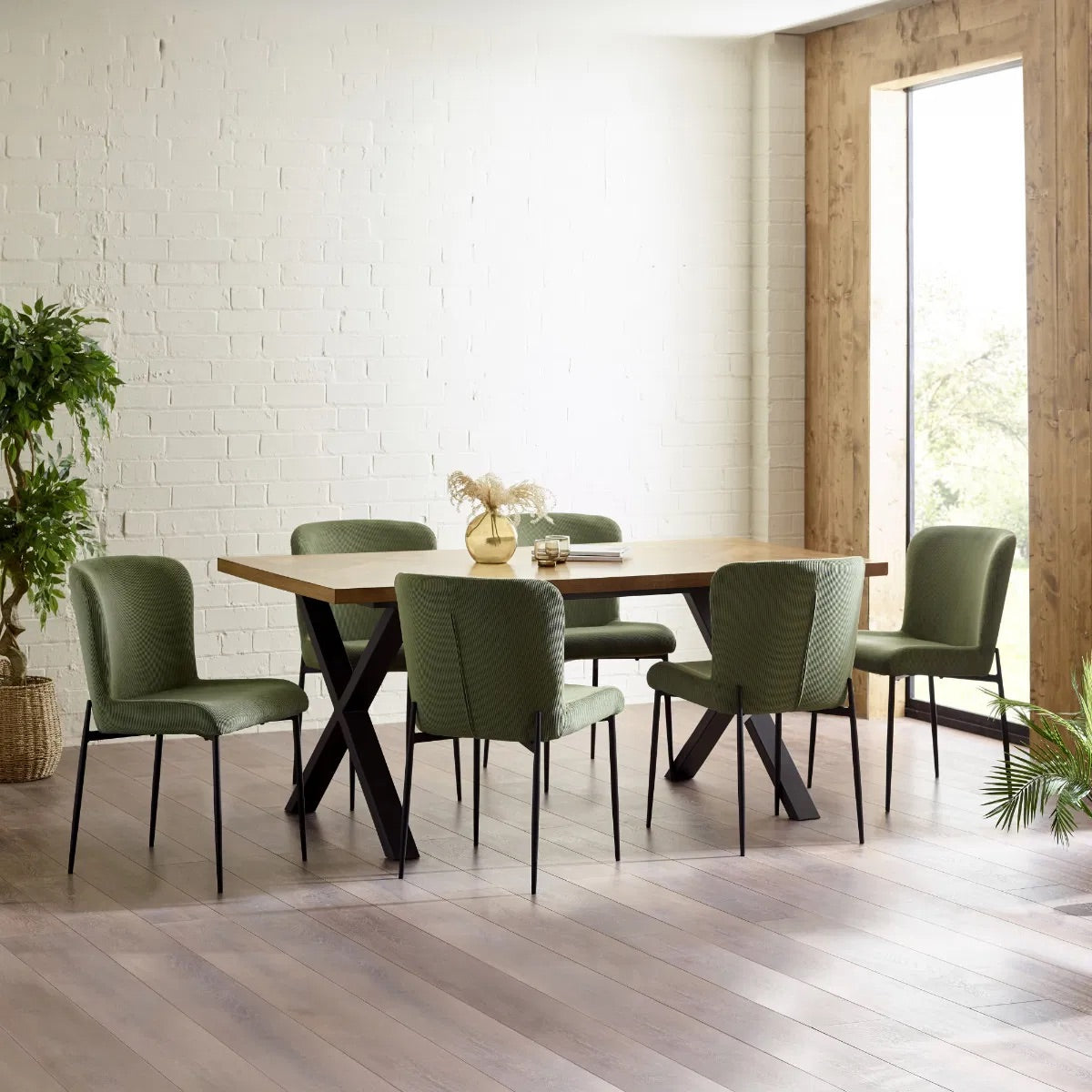 Shop the Aron Dining Table with eye-catching herringbone wood top with striking black metal base ensures lasting stability. Perfect for hosting dinners or enjoying everyday meals in style. Shop online at www.nobleandnook.co.uk
