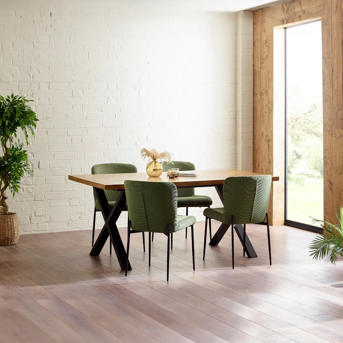 Shop the Aron Dining Table with eye-catching herringbone wood top with striking black metal base ensures lasting stability. Perfect for hosting dinners or enjoying everyday meals in style. Shop online at www.nobleandnook.co.uk