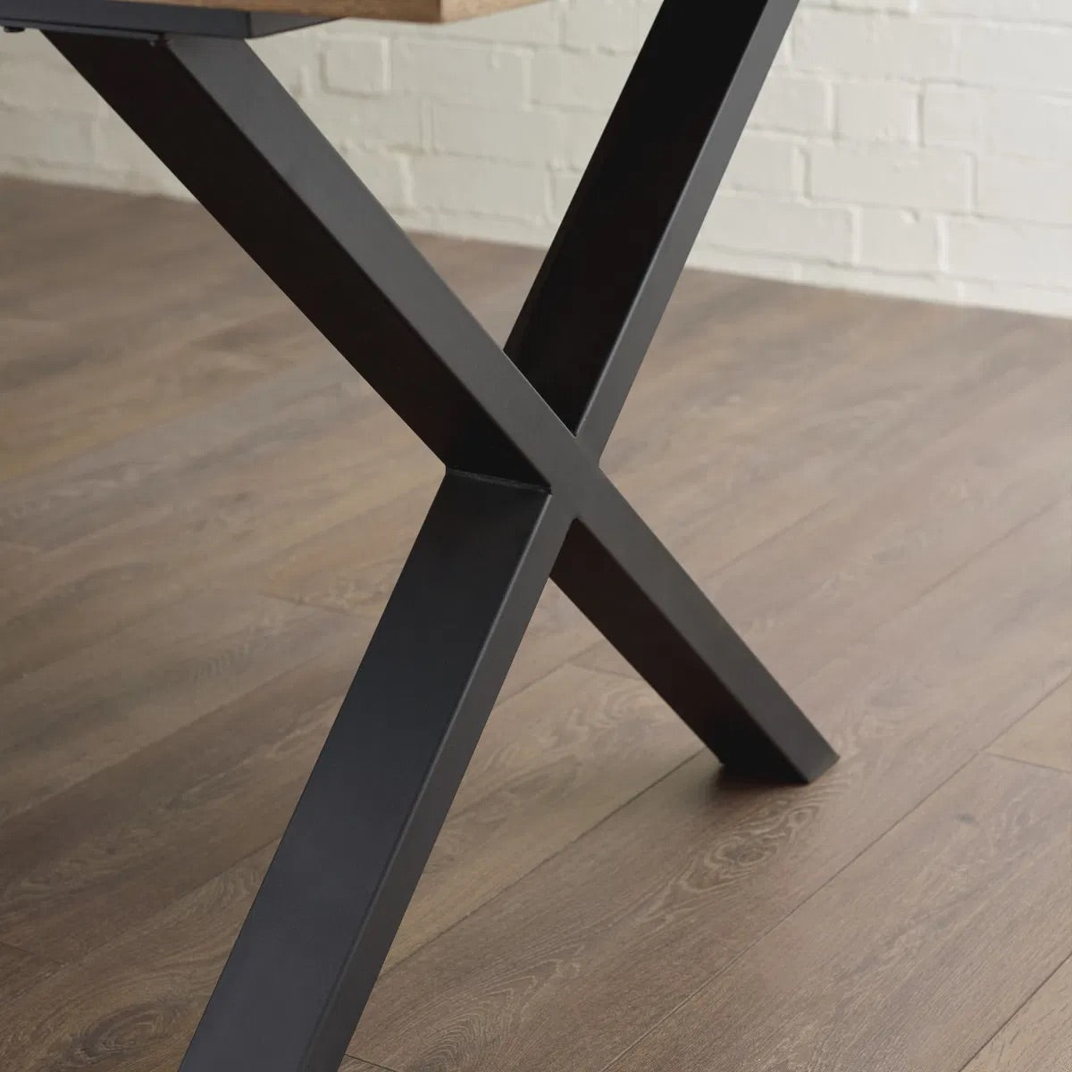 Shop the Aron Dining Table with eye-catching herringbone wood top with striking black metal base ensures lasting stability. Perfect for hosting dinners or enjoying everyday meals in style. Shop online at www.nobleandnook.co.uk