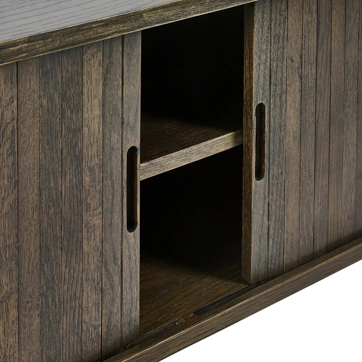 Elevate your living room with the Arya TV Media Unit in refined dark oak effect finish with sliding slatted doors. Perfect for modern homes. Shop online today at www.nobleandnook.co.uk