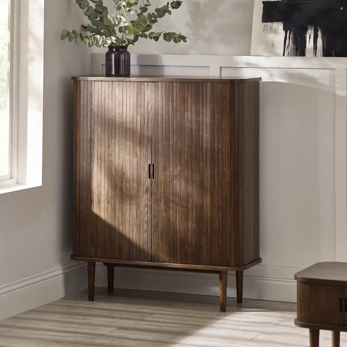 Add a touch of elegance and functionality to your entertaining space with the Arya Drinks Cabinet with sliding tambour doors reveal a well-designed interior. Available today at www.nobleandnook.co.uk