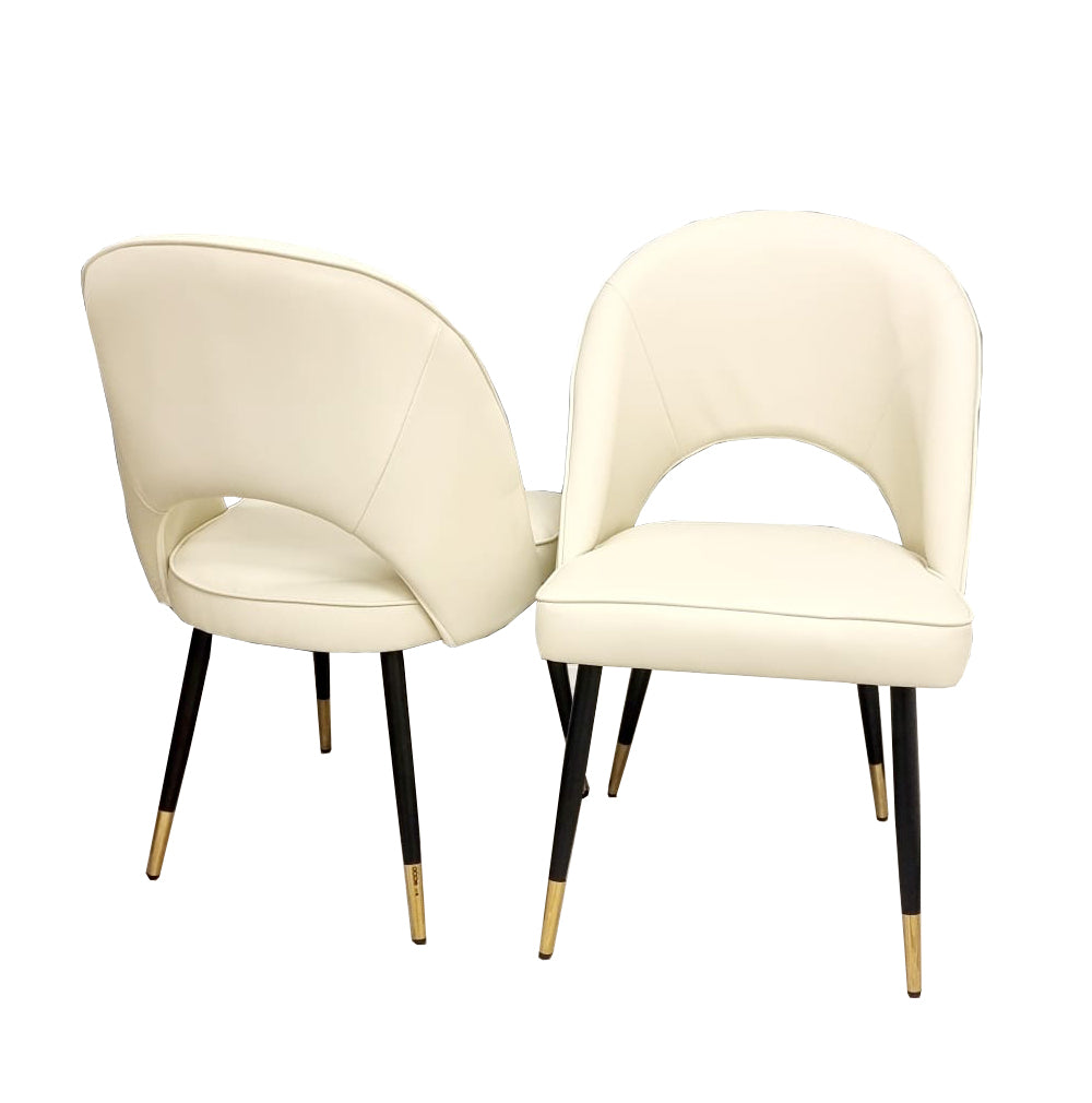 Enhance your dining space with the chic and contemporary Astra Dining Chairs, designed to deliver both comfort and style. Featuring a sleek curved open back and premium vegan upholstery. Shop online today at www.nobleandnook.co.uk