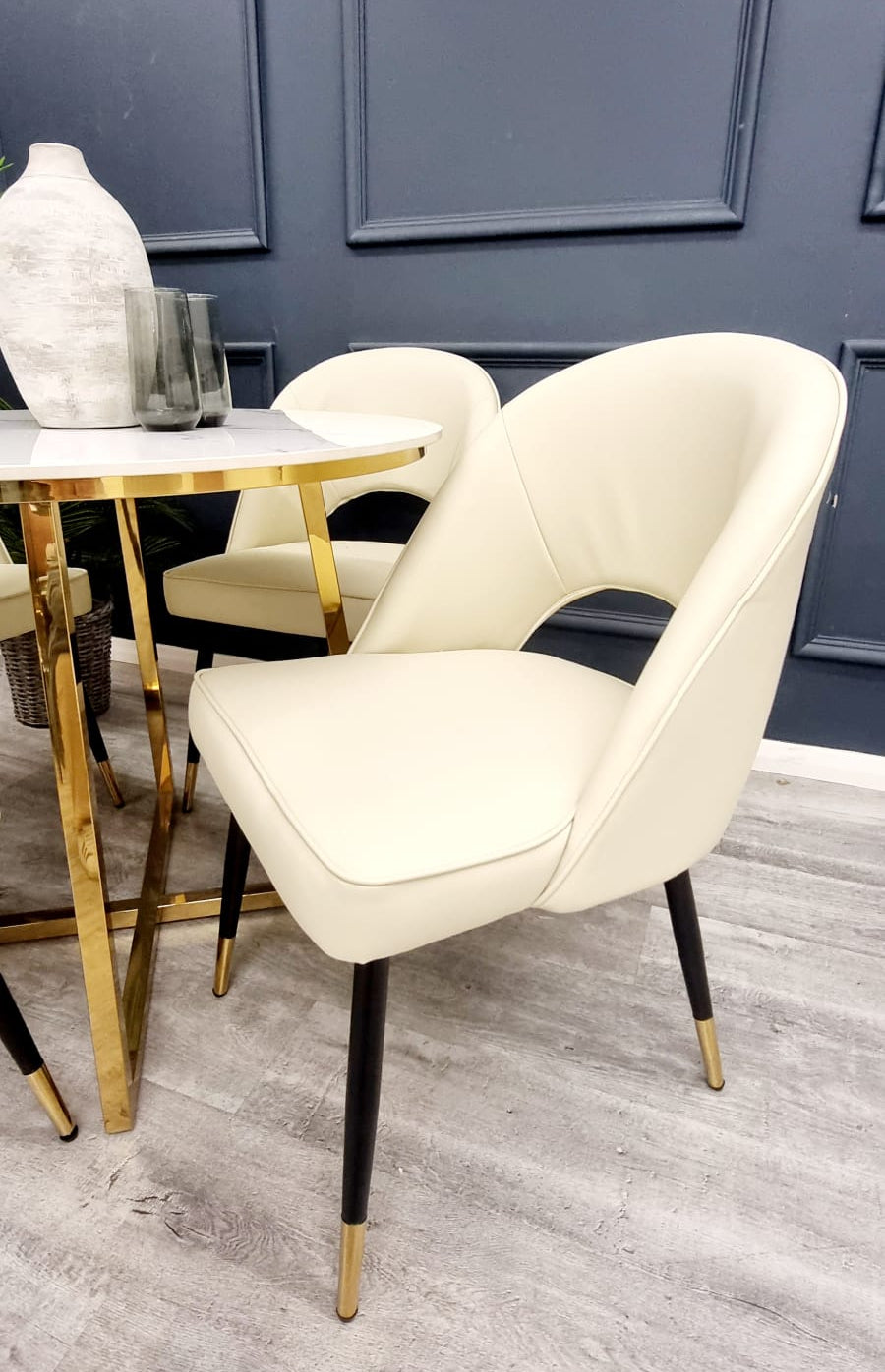 Enhance your dining space with the chic and contemporary Astra Dining Chairs, designed to deliver both comfort and style. Featuring a sleek curved open back and premium vegan upholstery. Shop online today at www.nobleandnook.co.uk