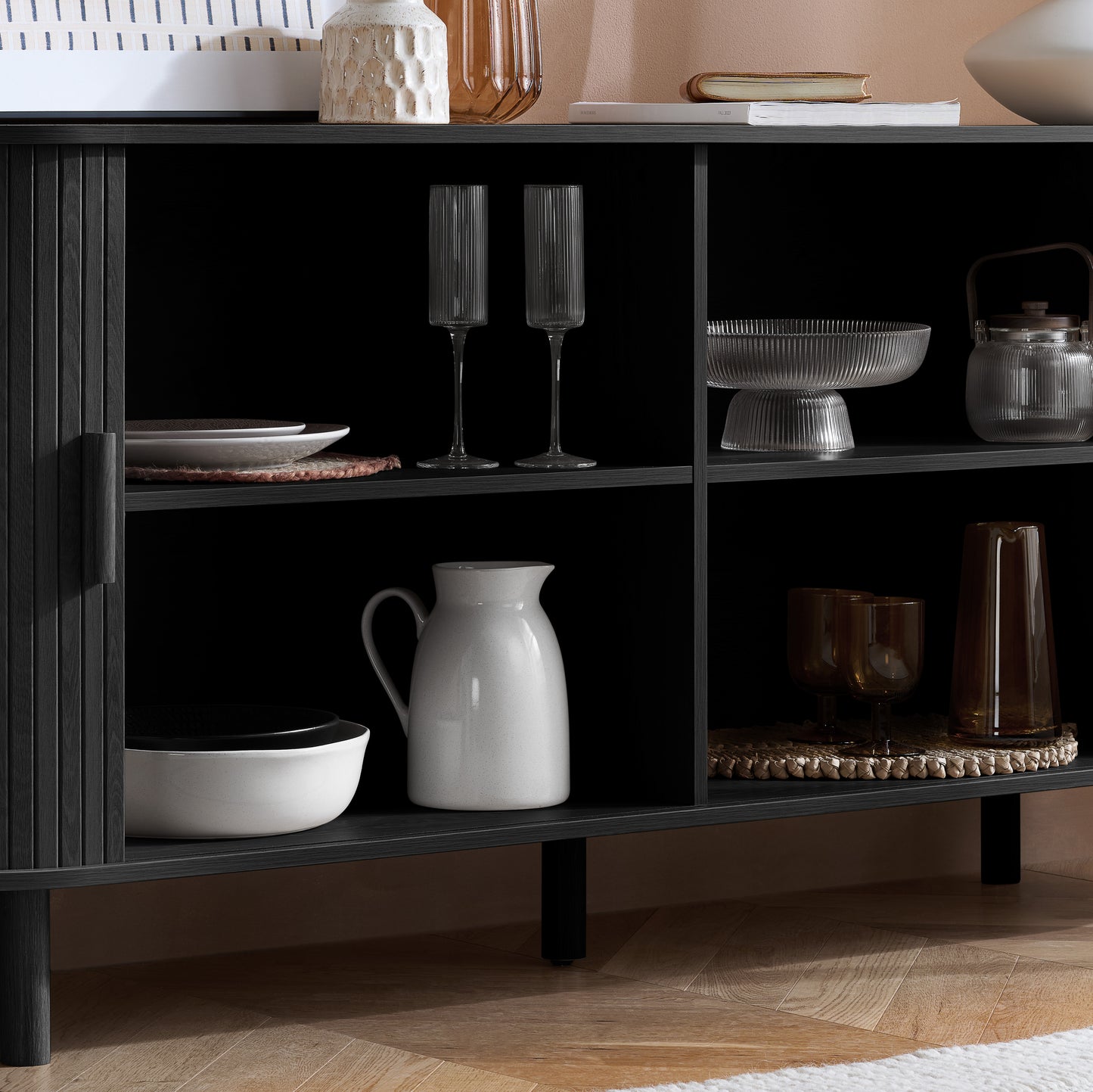 Elevate your interior with this 2 Door Fluted Sideboard, blending contemporary elegance with practical design and black finish adds sophistication to any room. Shop online at www.nobleandnook.co.uk