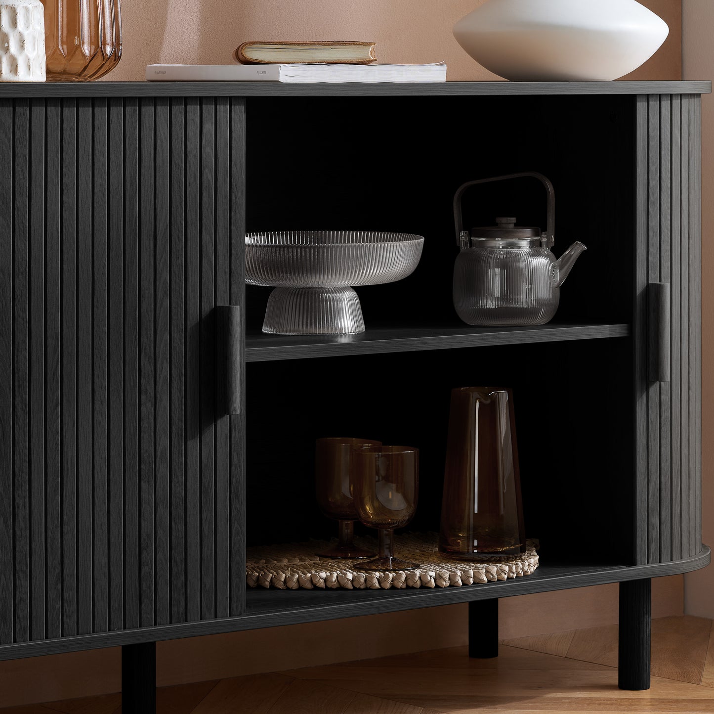 Elevate your interior with this 2 Door Fluted Sideboard, blending contemporary elegance with practical design and black finish adds sophistication to any room. Shop online at www.nobleandnook.co.uk