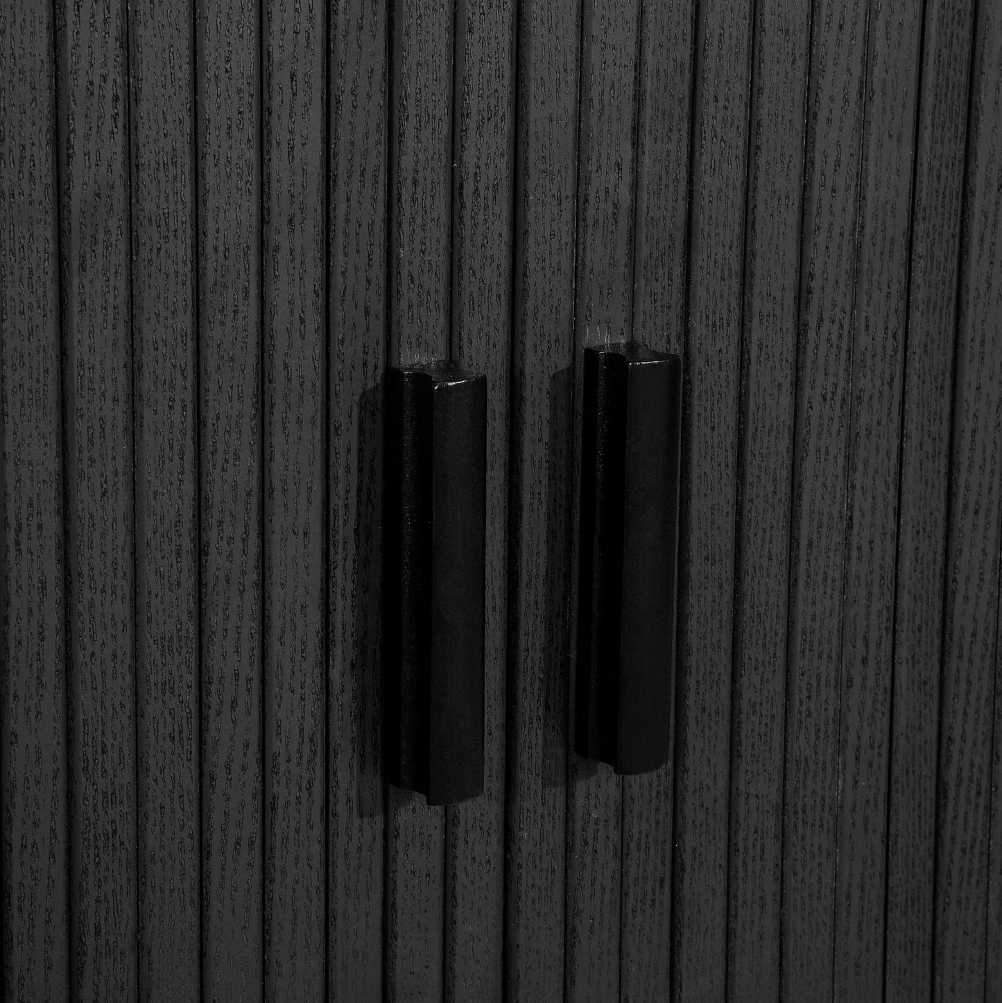 Elevate your interior with this 2 Door Fluted Sideboard, blending contemporary elegance with practical design and black finish adds sophistication to any room. Shop online at www.nobleandnook.co.uk