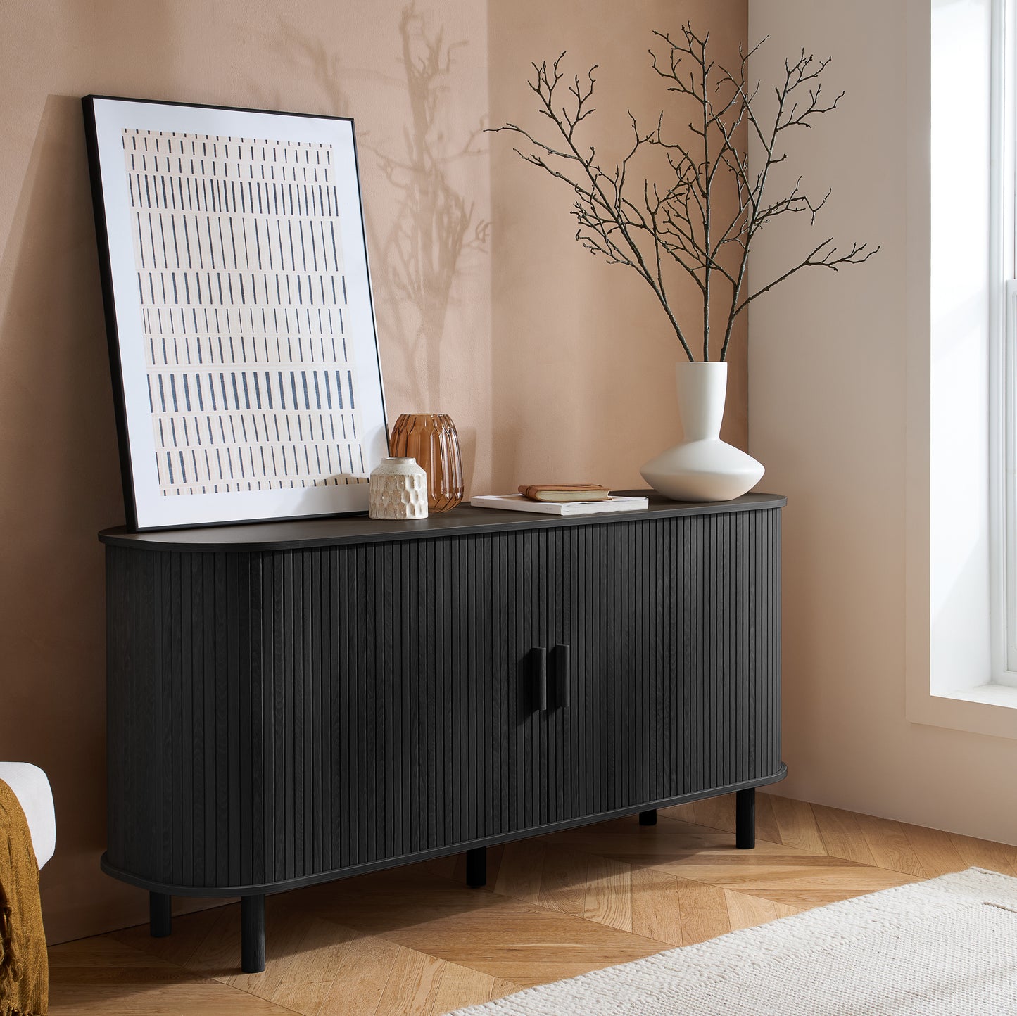 Elevate your interior with this 2 Door Fluted Sideboard, blending contemporary elegance with practical design and black finish adds sophistication to any room. Shop online at www.nobleandnook.co.uk