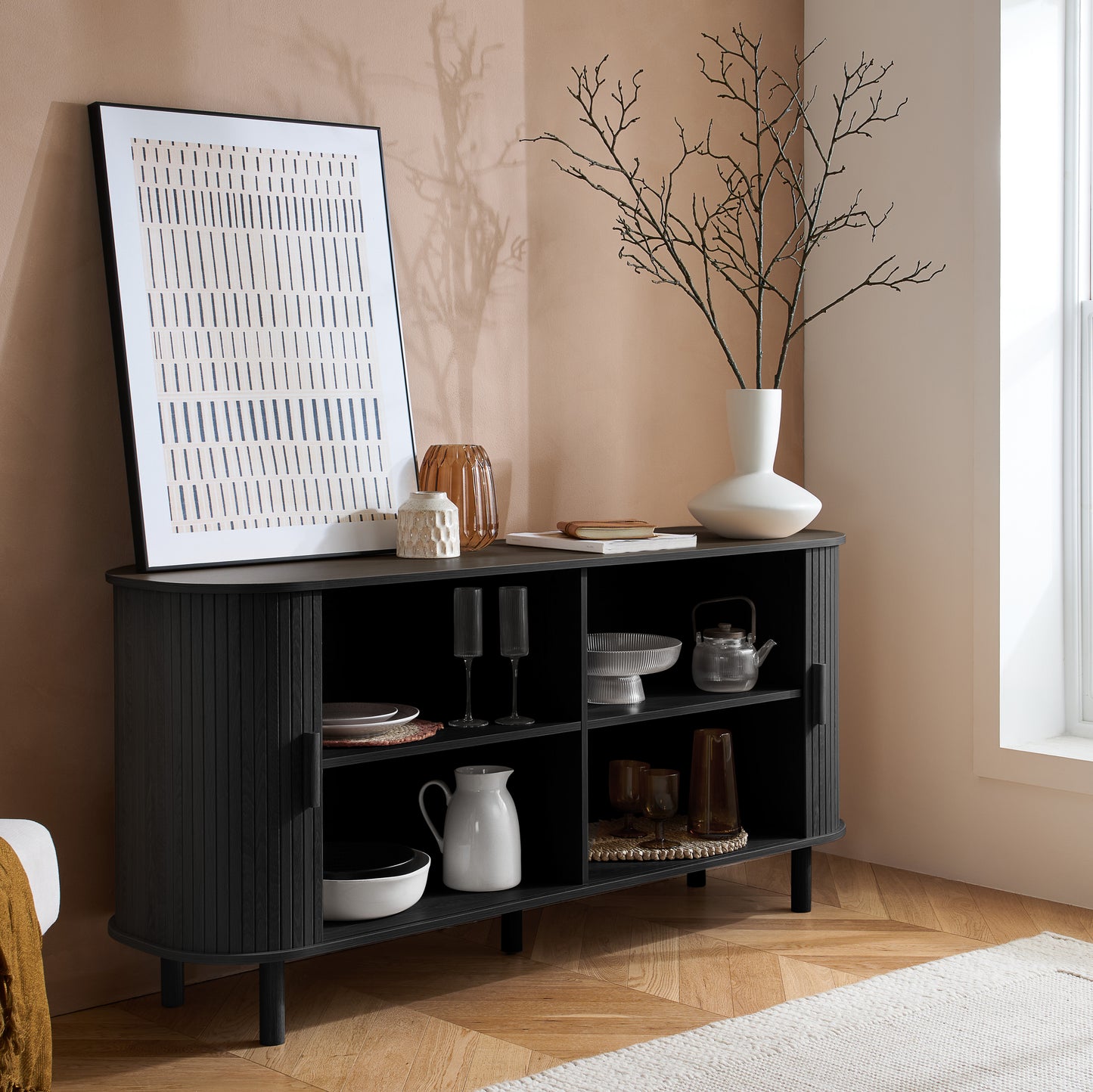 Elevate your interior with this 2 Door Fluted Sideboard, blending contemporary elegance with practical design and black finish adds sophistication to any room. Shop online at www.nobleandnook.co.uk
