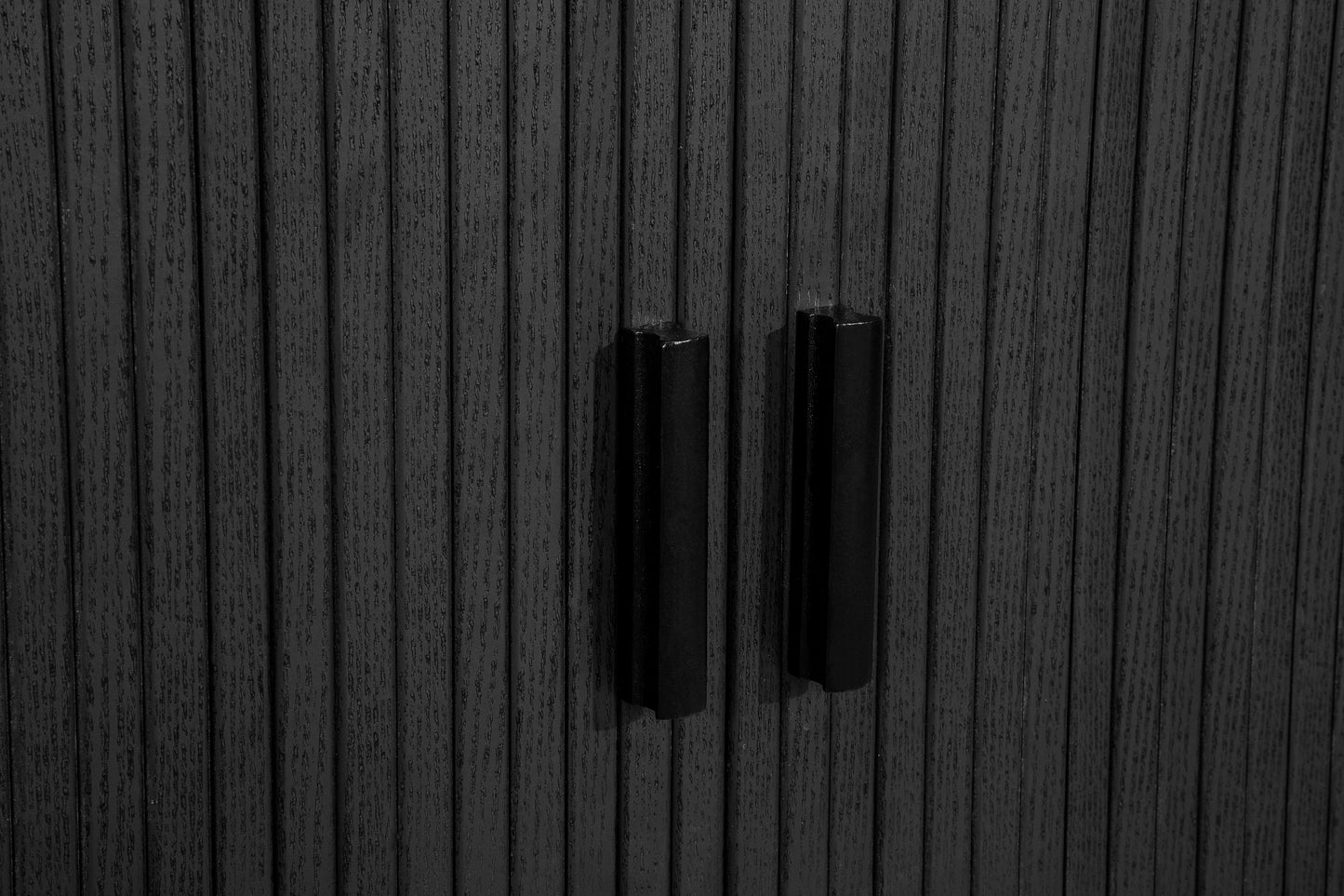 Elevate your interior with this 2 Door Fluted Sideboard, blending contemporary elegance with practical design and black finish adds sophistication to any room. Shop online at www.nobleandnook.co.uk