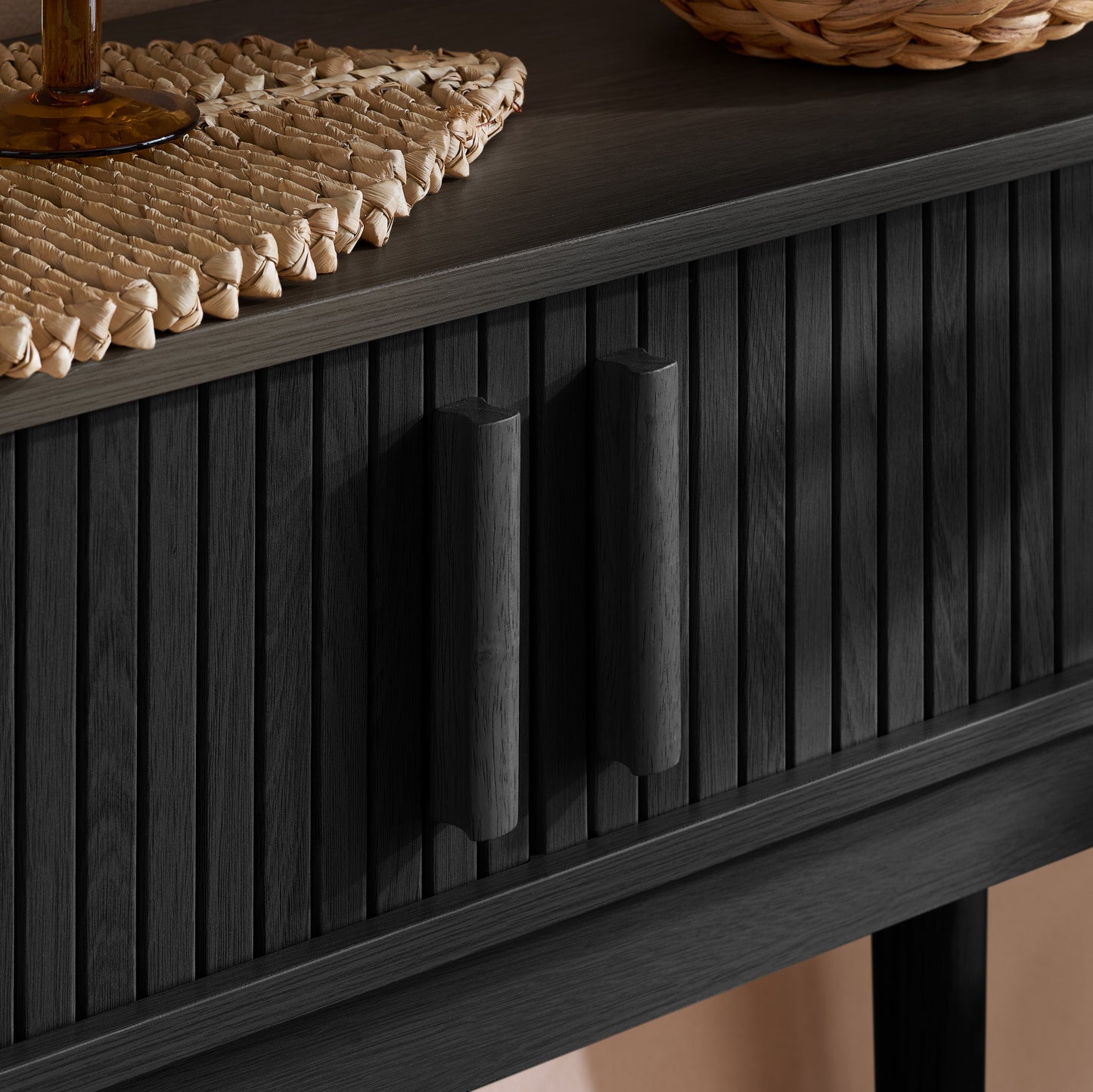 Elevate your interior with the Axel Console Table in Black. This stylish table features exquisite fluted detailing, adds depth and sophistication to any living space. Shop online today at www.nobleandnook.co.uk