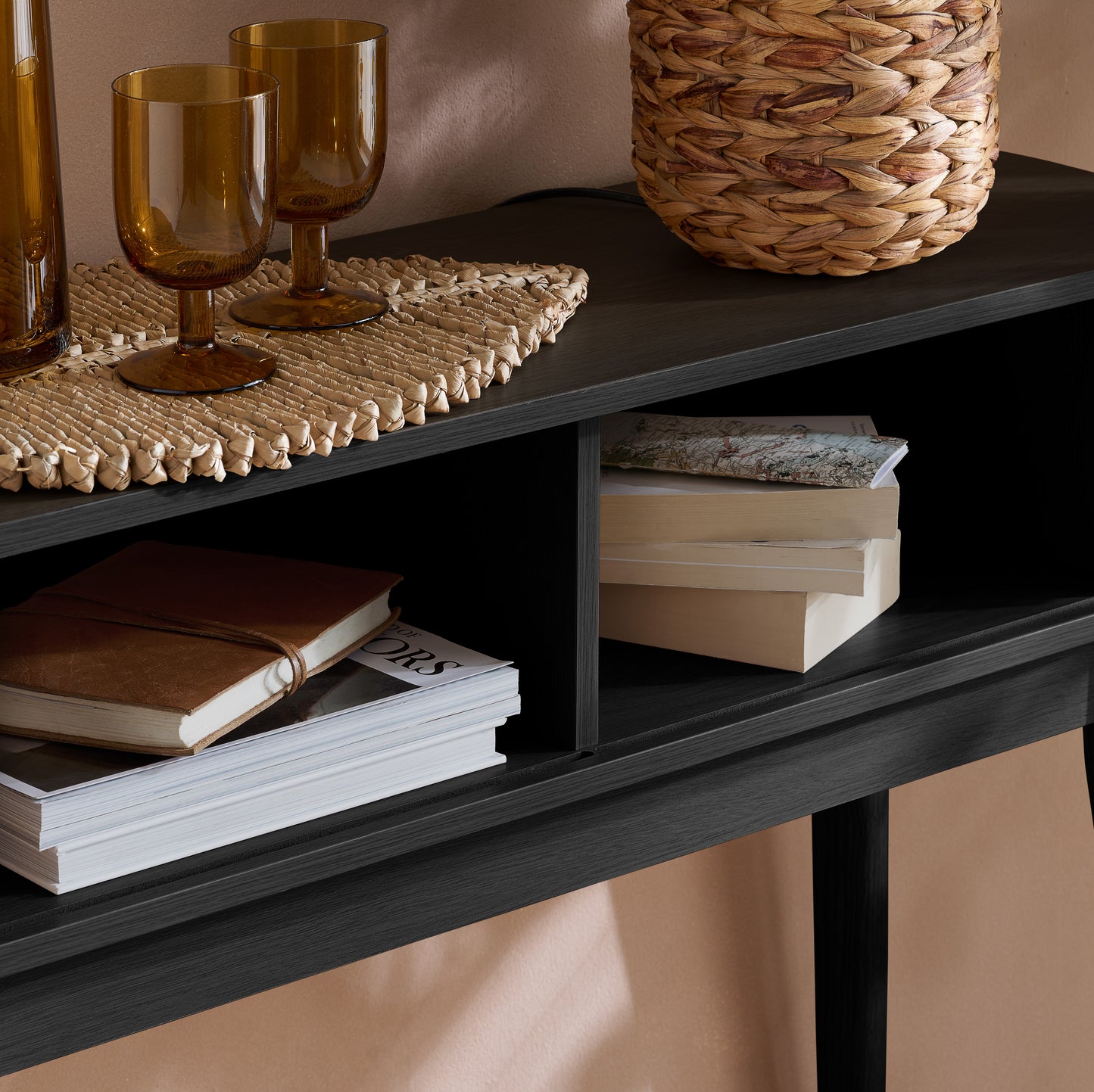 Elevate your interior with the Axel Console Table in Black. This stylish table features exquisite fluted detailing, adds depth and sophistication to any living space. Shop online today at www.nobleandnook.co.uk