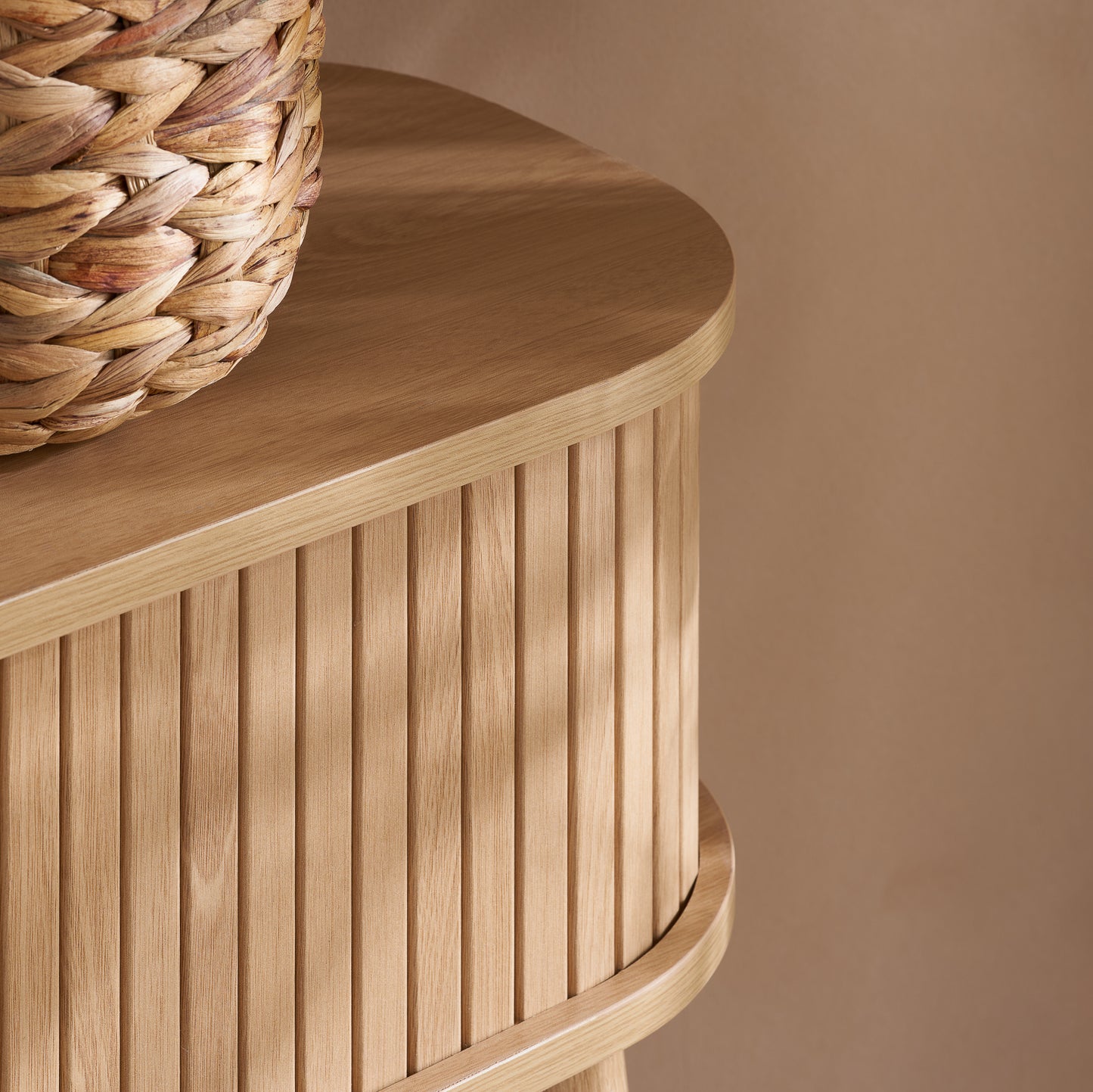 Elevate your interior with the Axel Console Table in an Oak Finish. This stylish table features exquisite fluted detailing, adds depth and sophistication to any living space. Shop online today at www.nobleandnook.co.uk