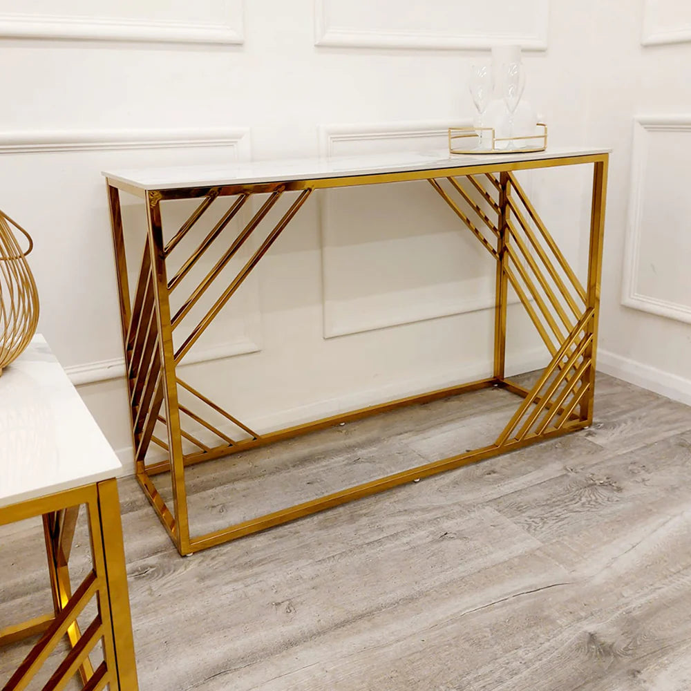 Shop now to redefine your interior design with the Azure Console Table. Featuring a gold tone frame with a Polar White Sintered Stone top. Perfectly suited for entrances and hallways. Shop online today at www.nobleandnook.co.uk