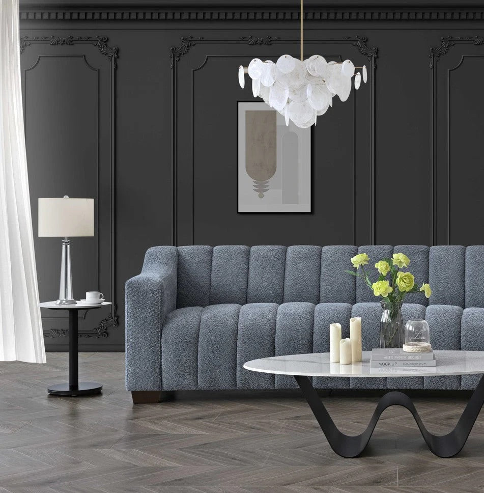 Indulge in luxury with the Astoria 3 Seater Sofa. An exquisite piece featuring deep channel stitching and adorned with a soft and alluring boucle fabric in a strong iron hue. Shop online today at www.nobleandnook.co.uk