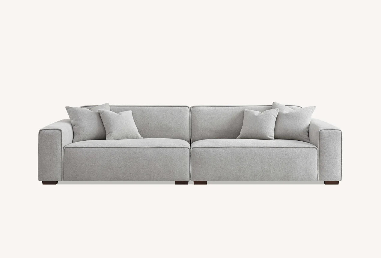 Shop the Aluxo Dakota, an exquisitely designed sofa providing unparalleled comfort and luxury with generous padding of duck feathers along the arms, seats, and back, it boasts a boxed silhouette and elegant piping detail, expertly combining modern luxury with timeless opulence. Shop online today at www.nobleandnook.co.uk SKU 10-T-SF003-DKT-G302-3A-CR