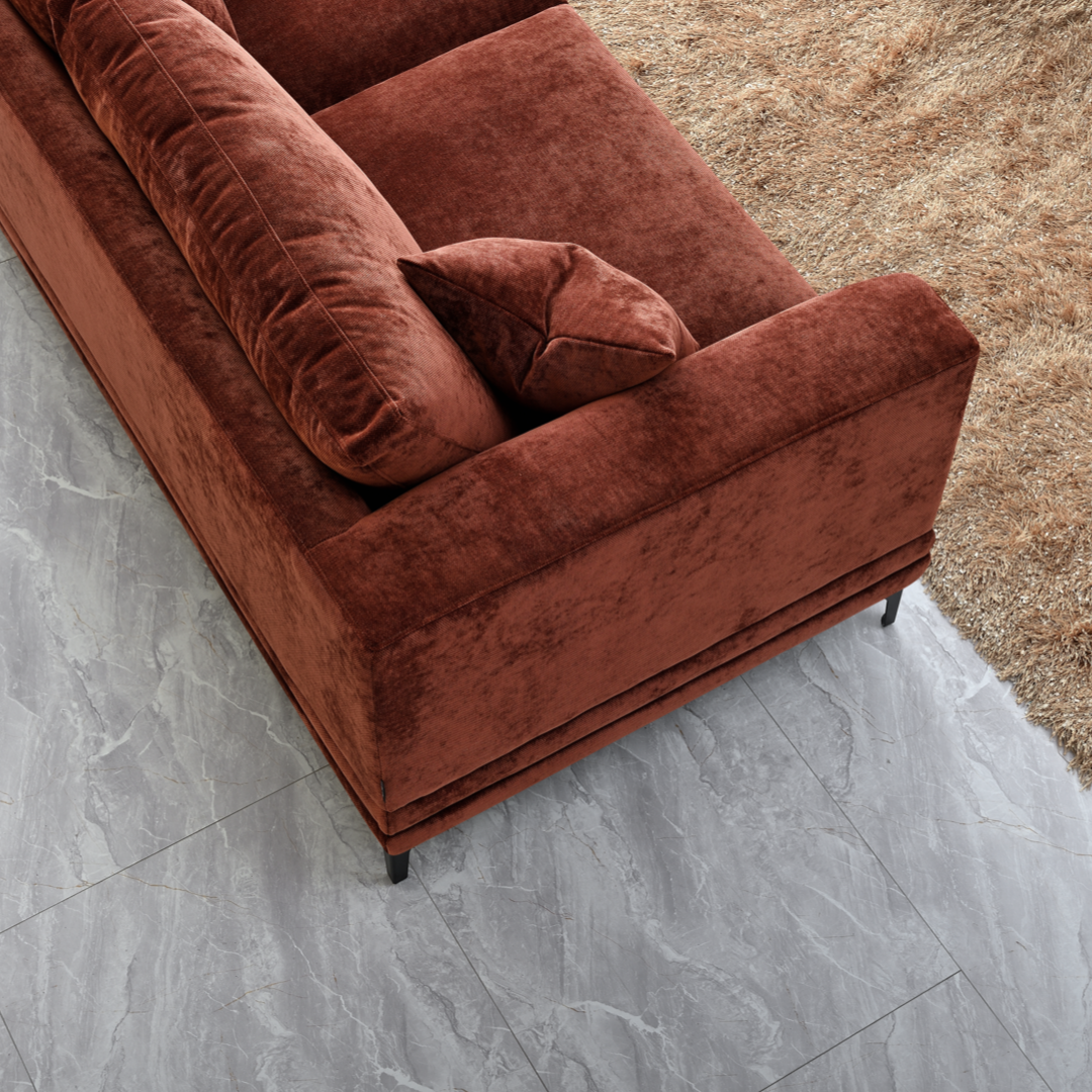 Shop the Aluxo Lenox 3 Seater Sofa in Rust Velvet, a timeless mid-century modern sofa that combines sleek lines and minimalist design with deep, sumptuous cushions for the utmost comfort. Crafted with a solid wooden frame and high-density foam padding. Shop online today at www.nobleandnook.co.uk