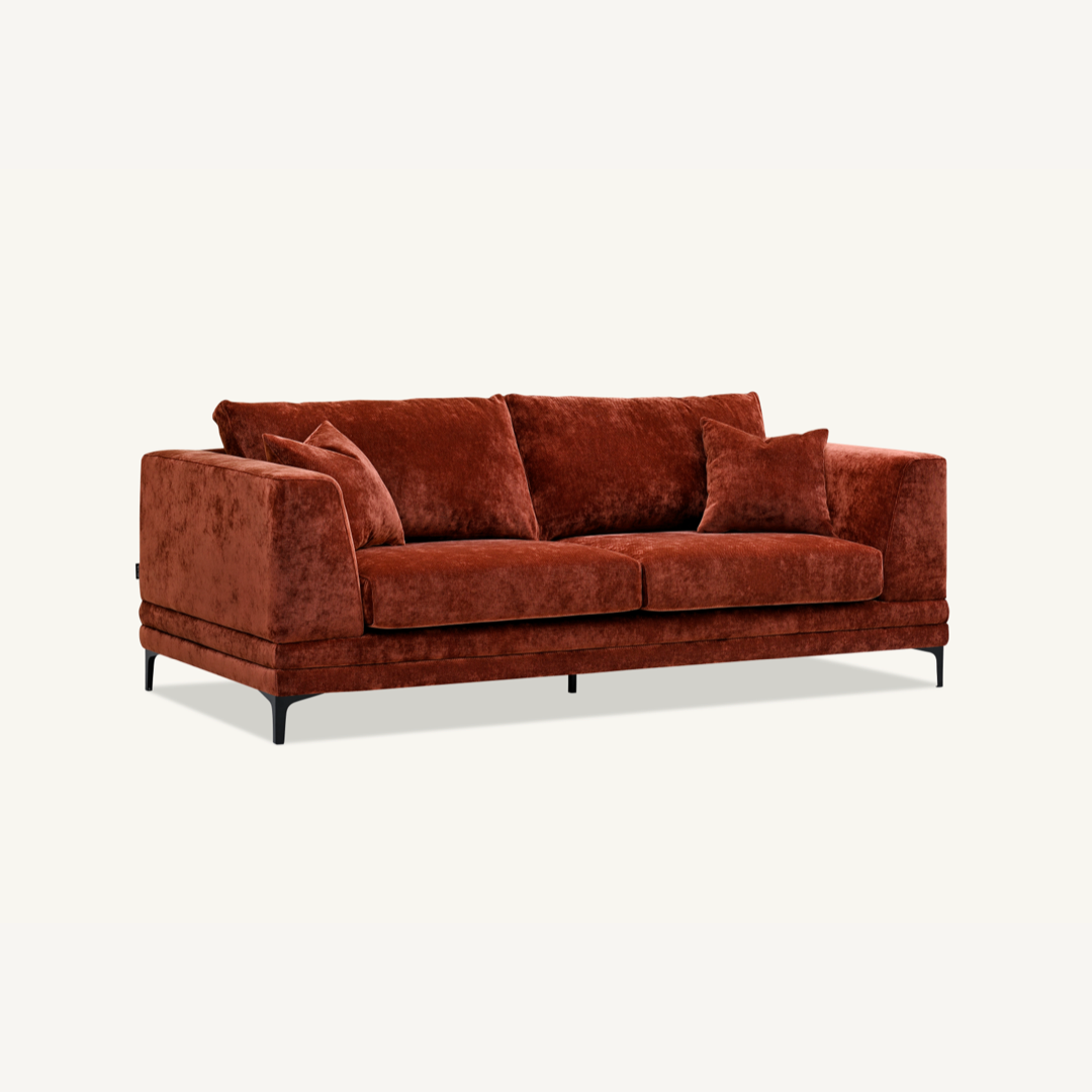 Shop the Aluxo Lenox 3 Seater Sofa in Rust Velvet, a timeless mid-century modern sofa that combines sleek lines and minimalist design with deep, sumptuous cushions for the utmost comfort. Crafted with a solid wooden frame and high-density foam padding. Shop online today at www.nobleandnook.co.uk