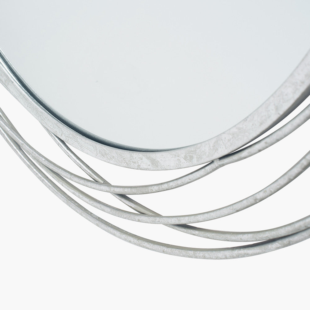 Featuring delicate swirling metalwork finished in a stunning antique silver, this mirror brings light, depth, and elegance to your space. Shop online now at www.nobleandnook.co.uk