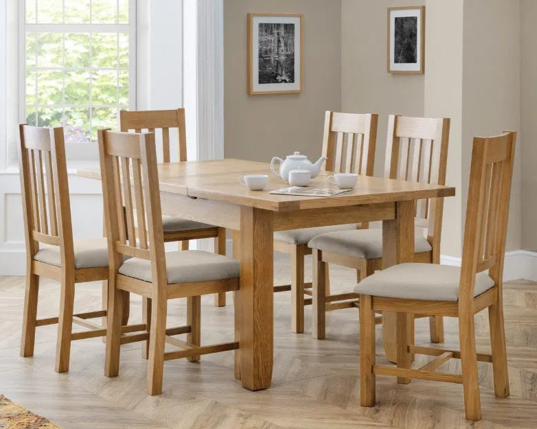 Bring timeless elegance and everyday functionality to your dining room with the Astoria extending dining table with a thick 40mm top in a waxed oak finish. Shop online today at www.nobleandnook.co.uk