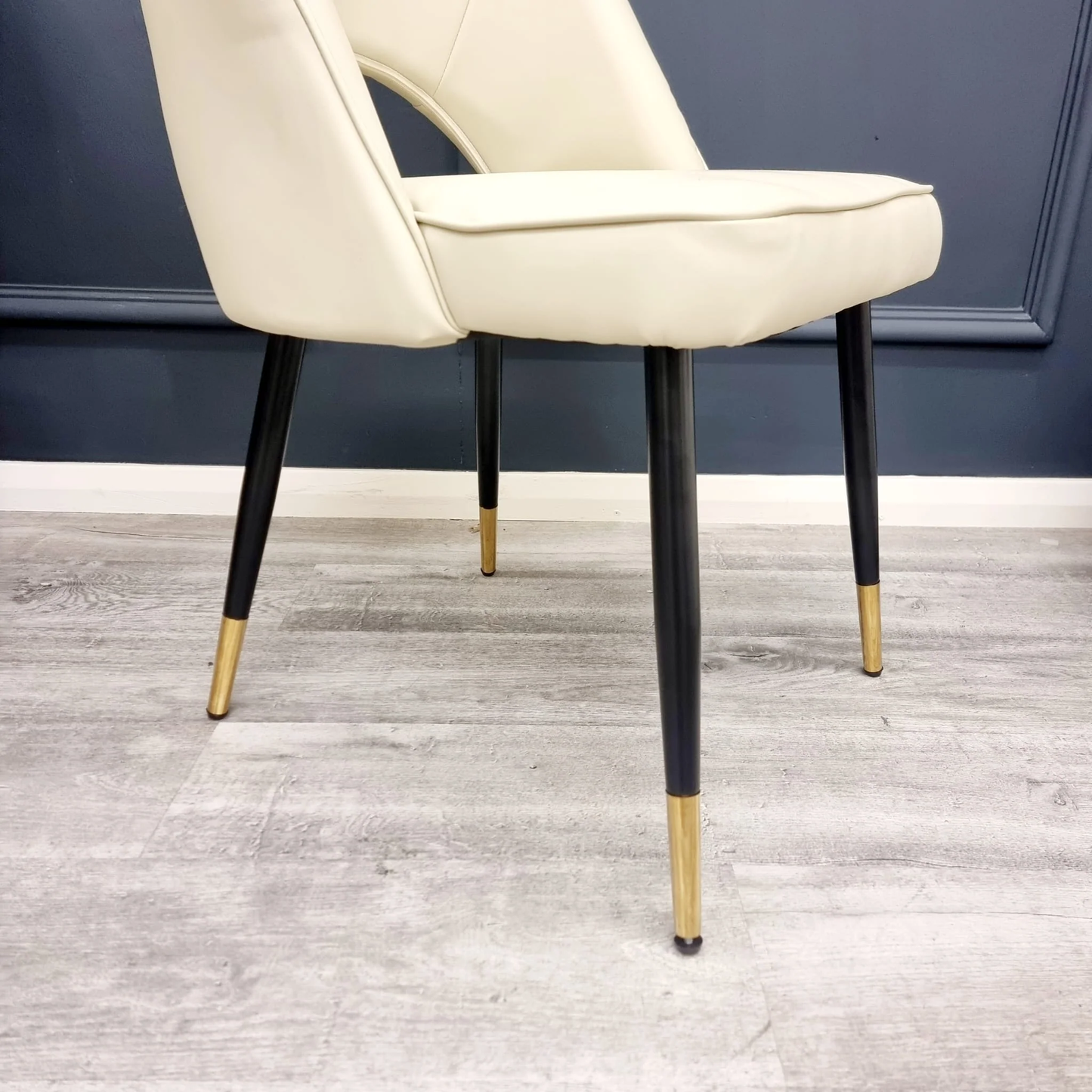 Enhance your dining space with the chic and contemporary Astra Dining Chairs, designed to deliver both comfort and style. Featuring a sleek curved open back and premium vegan upholstery. Shop online today at www.nobleandnook.co.uk