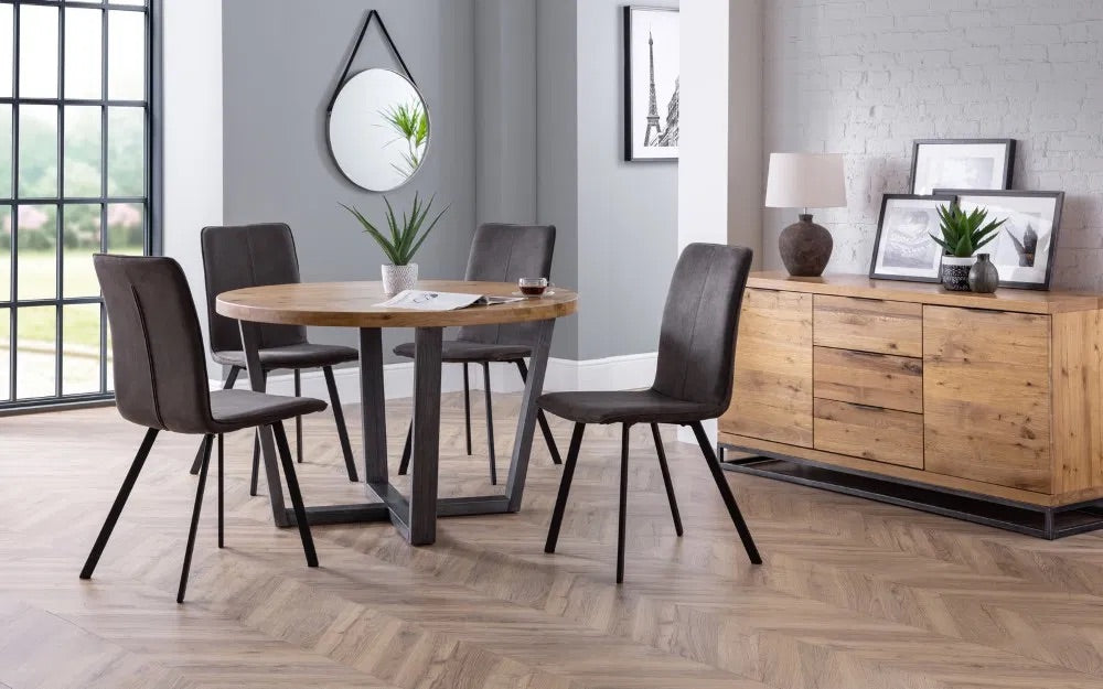 Bring industrial charm and rustic warmth to your dining space with the Brooklyn Round Dining Table finished from solid oak and designed to seat four people. Dimensions: H76xL120xW120cm. Shop online today at www.nobleandnook.co.uk