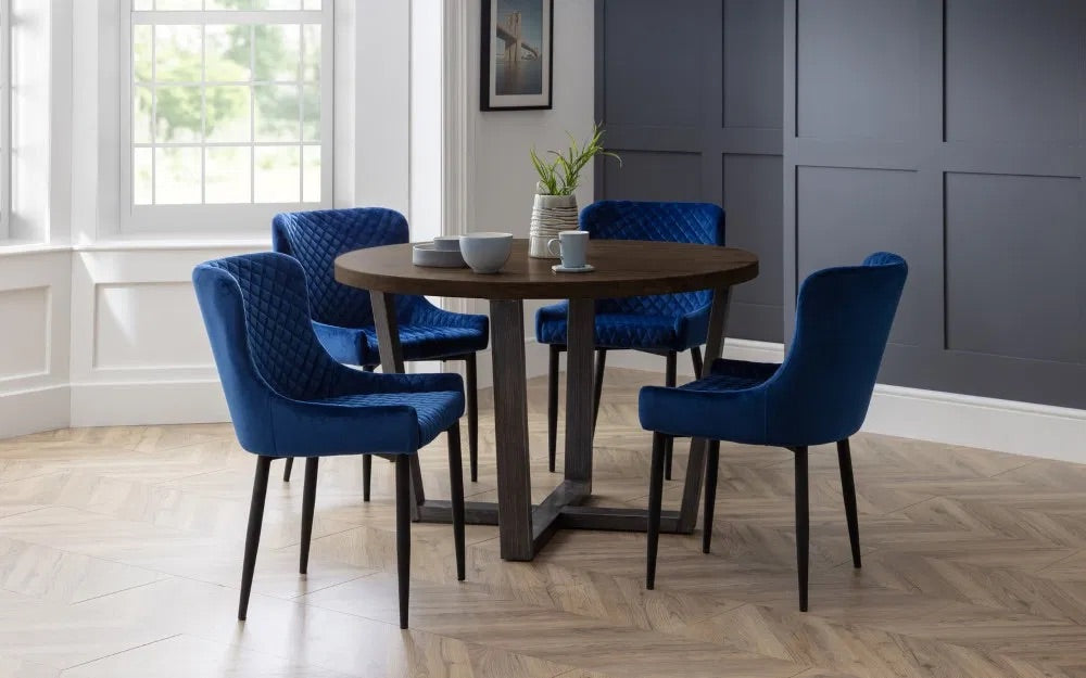 Bring industrial charm and rustic warmth to your dining space with the Brooklyn Round Dining Table finished from solid oak and designed to seat four people. Dimensions: H76xL120xW120cm. Shop online today at www.nobleandnook.co.uk