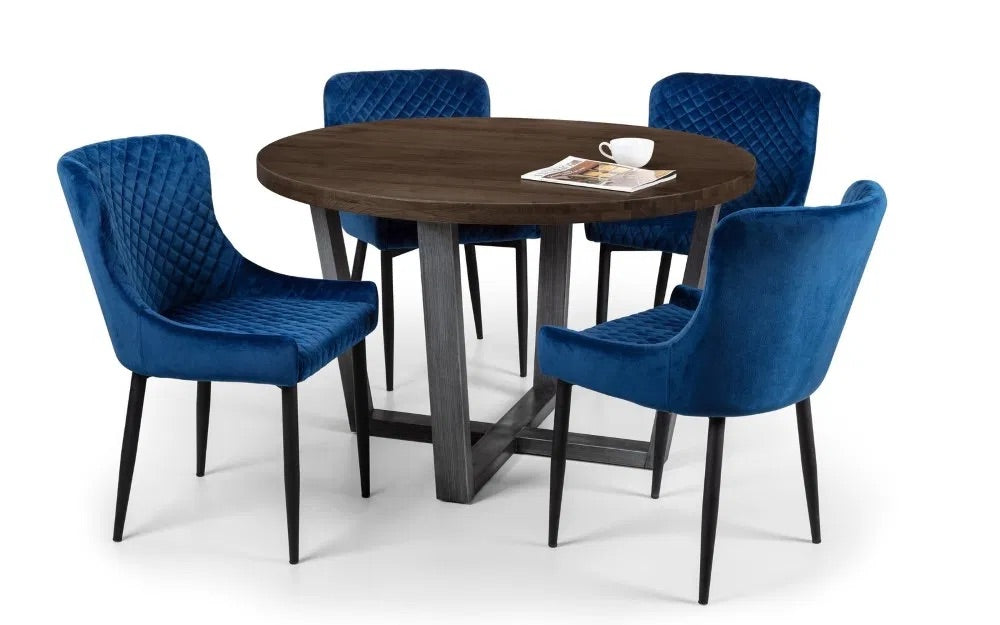 Bring industrial charm and rustic warmth to your dining space with the Brooklyn Round Dining Table finished from solid oak and designed to seat four people. Dimensions: H76xL120xW120cm. Shop online today at www.nobleandnook.co.uk