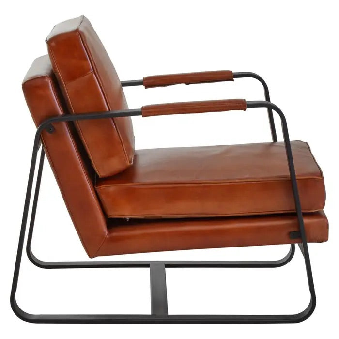 This Buffalo Tan Leather Armchair features genuine tan leather upholstery and a sleek black iron frame, offering both comfort and durability. Free UK Mainland Delivery. Shop online today at www.nobleandnook.co.uk
