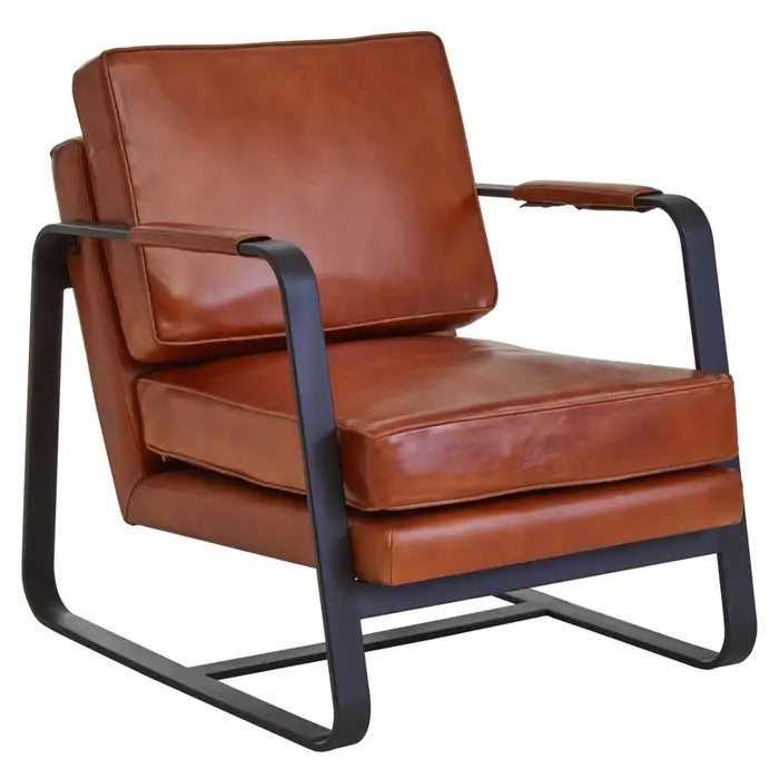 This Buffalo Tan Leather Armchair features genuine tan leather upholstery and a sleek black iron frame, offering both comfort and durability. Free UK Mainland Delivery. Shop online today at www.nobleandnook.co.uk
