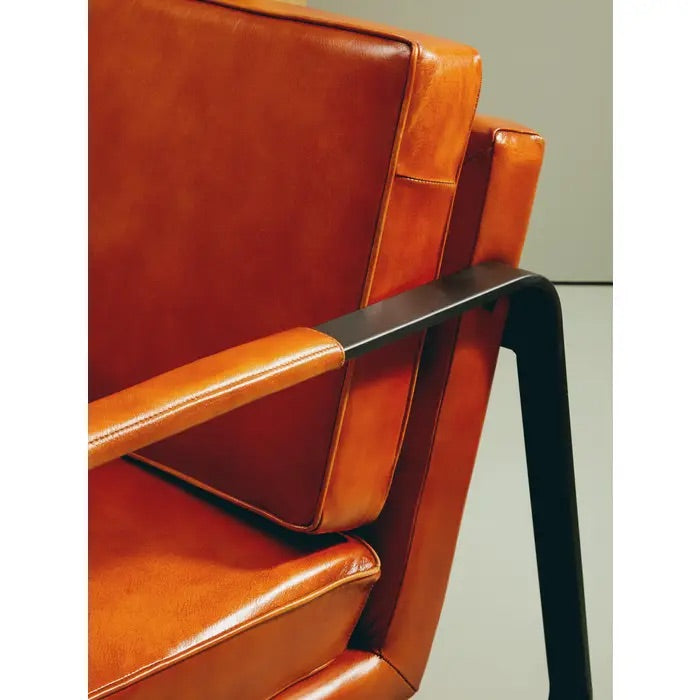 This Buffalo Tan Leather Armchair features genuine tan leather upholstery and a sleek black iron frame, offering both comfort and durability. Free UK Mainland Delivery. Shop online today at www.nobleandnook.co.uk