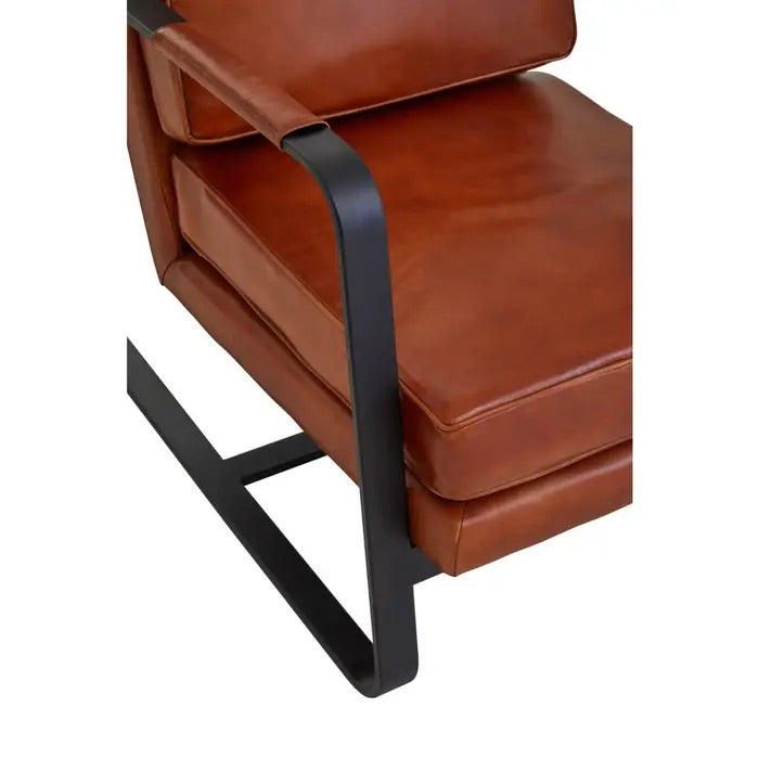 This Buffalo Tan Leather Armchair features genuine tan leather upholstery and a sleek black iron frame, offering both comfort and durability. Free UK Mainland Delivery. Shop online today at www.nobleandnook.co.uk