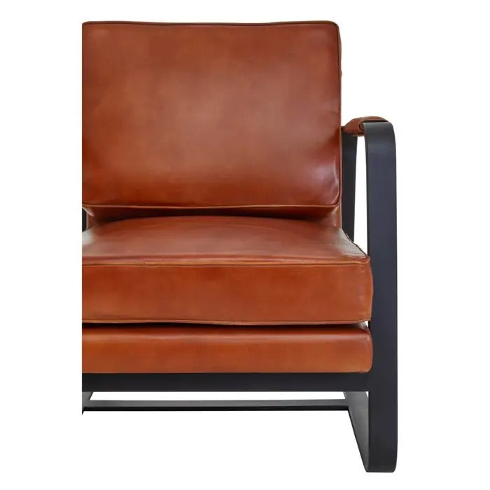 This Buffalo Tan Leather Armchair features genuine tan leather upholstery and a sleek black iron frame, offering both comfort and durability. Free UK Mainland Delivery. Shop online today at www.nobleandnook.co.uk