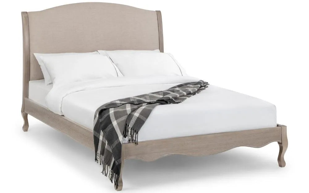Shop a classic French design. The frame is finished in a limed oak effect, a soft upholstered headboard covered in an oatmeal linen fabric. Shop online today at www.nobleandnook.co.uk