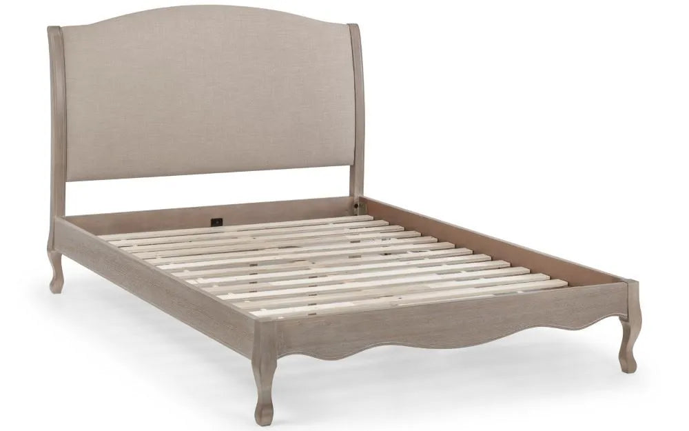 Shop a classic French design. The frame is finished in a limed oak effect, a soft upholstered headboard covered in an oatmeal linen fabric. Shop online today at www.nobleandnook.co.uk