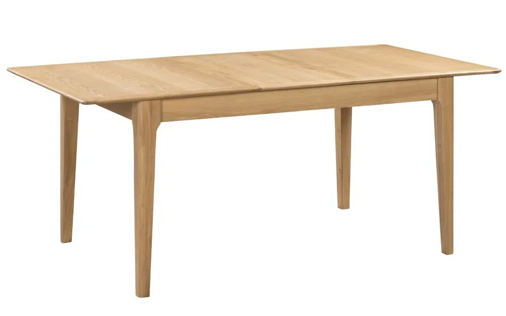 The Cotswold Extending Dining Table, crafted from solid oak and oak veneers, making it a standout piece for both classic and contemporary interiors. Ideal for family dining or entertaining guests
