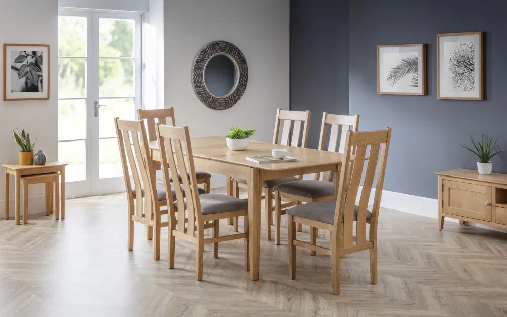 The Cotswold Extending Dining Table, crafted from solid oak and oak veneers, making it a standout piece for both classic and contemporary interiors. Ideal for family dining or entertaining guests