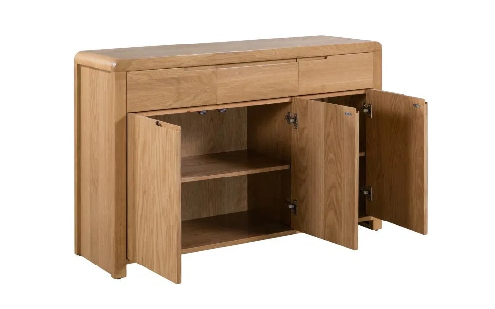The Curve Oak Sideboard brings together the best of retro charm and modern functionality. Its expertly crafted oak finish and flowing lines measure H85xL130xW40cm. Shop online today at www.nobleandnook.co.uk