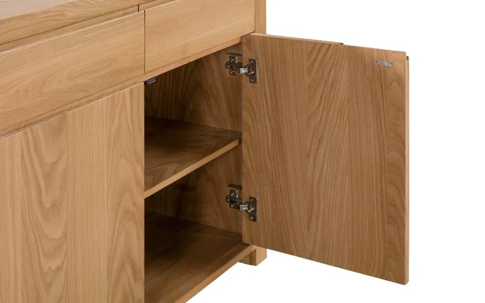 The Curve Oak Sideboard brings together the best of retro charm and modern functionality. Its expertly crafted oak finish and flowing lines measure H85xL130xW40cm. Shop online today at www.nobleandnook.co.uk