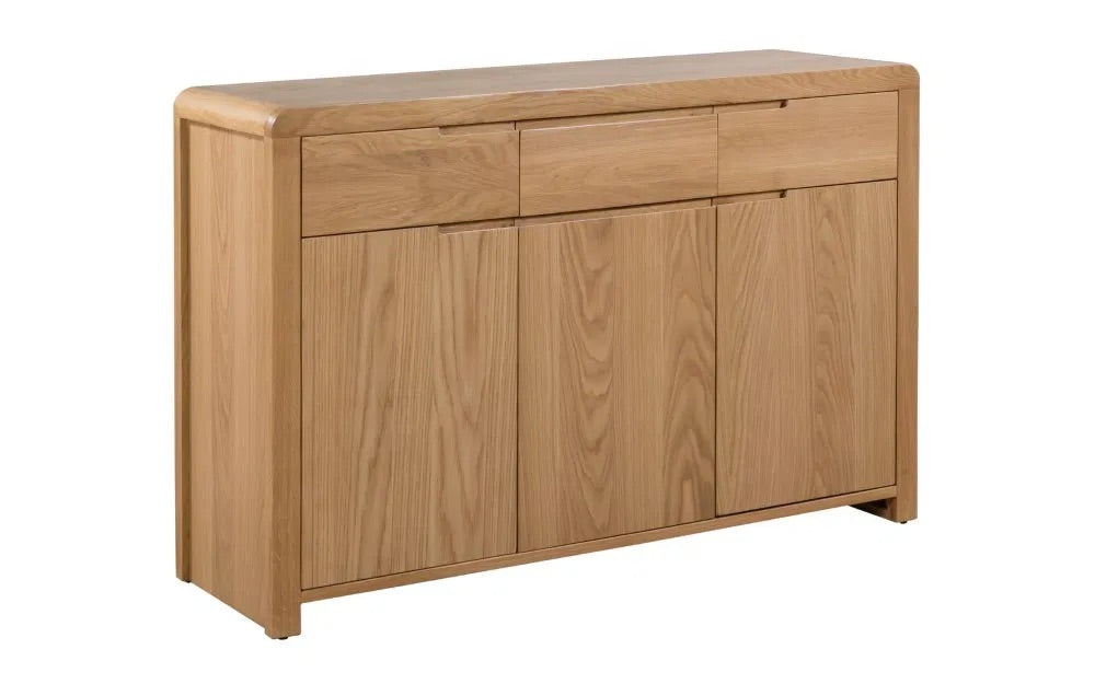 The Curve Oak Sideboard brings together the best of retro charm and modern functionality. Its expertly crafted oak finish and flowing lines measure H85xL130xW40cm. Shop online today at www.nobleandnook.co.uk