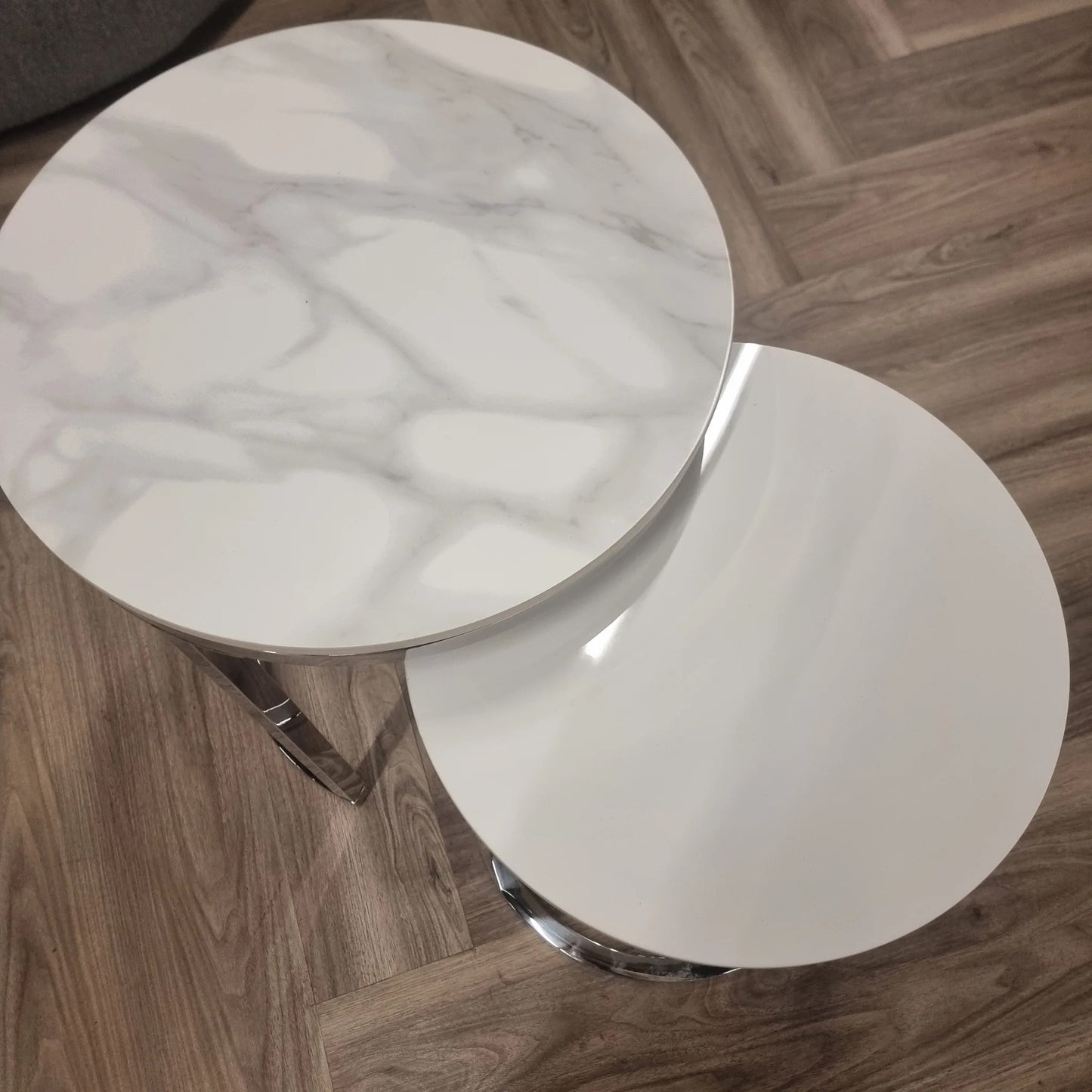 Shop the Calix Nest of 2 Tall End Tables, a stunning combination of modern elegance and practical design. Featuring Polar White sintered stone tops and sleek silver chrome frames. Shop online today at www.nobleandnook.co.uk