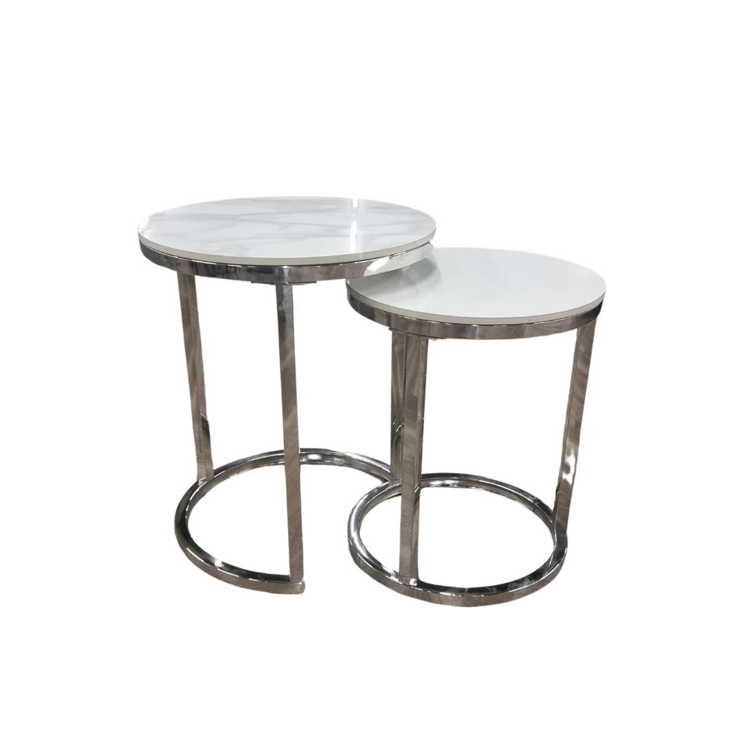 Shop the Calix Nest of 2 Tall End Tables, a stunning combination of modern elegance and practical design. Featuring Polar White sintered stone tops and sleek silver chrome frames. Shop online today at www.nobleandnook.co.uk