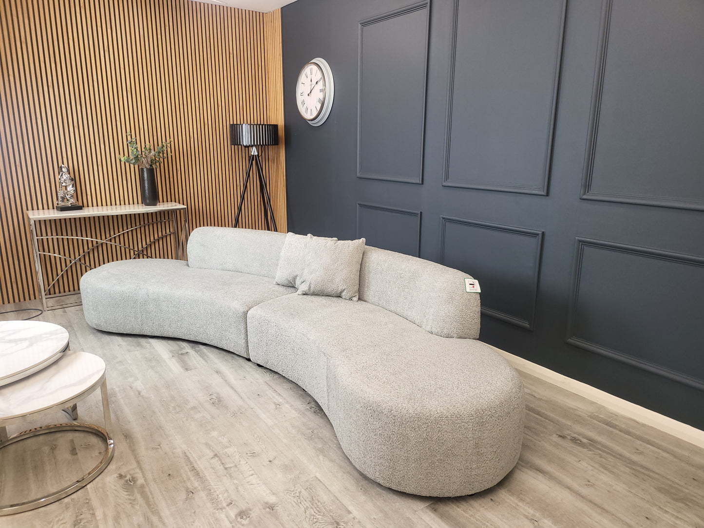 The Miami Curved Cinema Sofa, upholstered in soft and textured bouclé fabric. Perfect for a home games room or home cinema. Shop online today at www.nobleandnook.co.uk