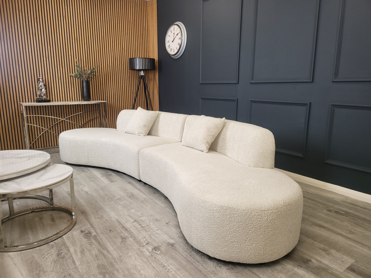 The Miami Curved Cinema Sofa, upholstered in soft and textured bouclé fabric. Perfect for a home games room or home cinema. Shop online today at www.nobleandnook.co.uk