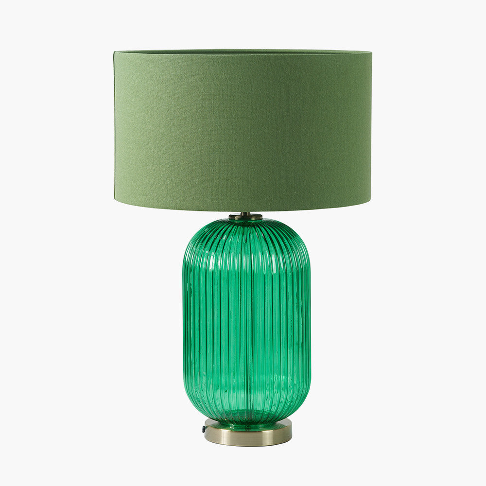 Created in collaboration with the Designers Guild. A blend of premium design and artisanal craft Deep Emerald Ribbed Glass Base with antique brass accents. Ideal for statement lighting in living rooms, bedrooms, or stylish office spaces. Available at www.nobleandnook.co.uk