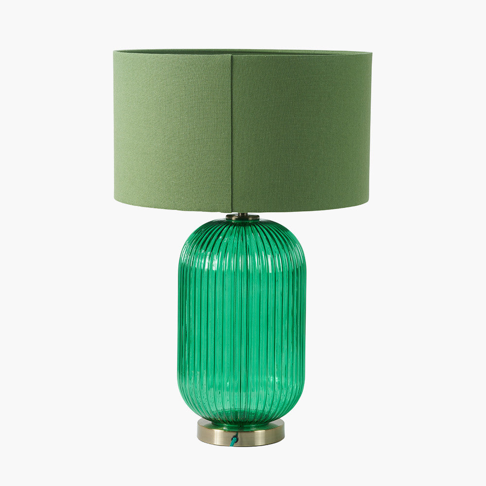 Created in collaboration with the Designers Guild. A blend of premium design and artisanal craft Deep Emerald Ribbed Glass Base with antique brass accents. Ideal for statement lighting in living rooms, bedrooms, or stylish office spaces. Available at www.nobleandnook.co.uk