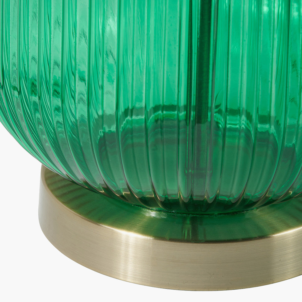 Created in collaboration with the Designers Guild. A blend of premium design and artisanal craft Deep Emerald Ribbed Glass Base with antique brass accents. Ideal for statement lighting in living rooms, bedrooms, or stylish office spaces. Available at www.nobleandnook.co.uk