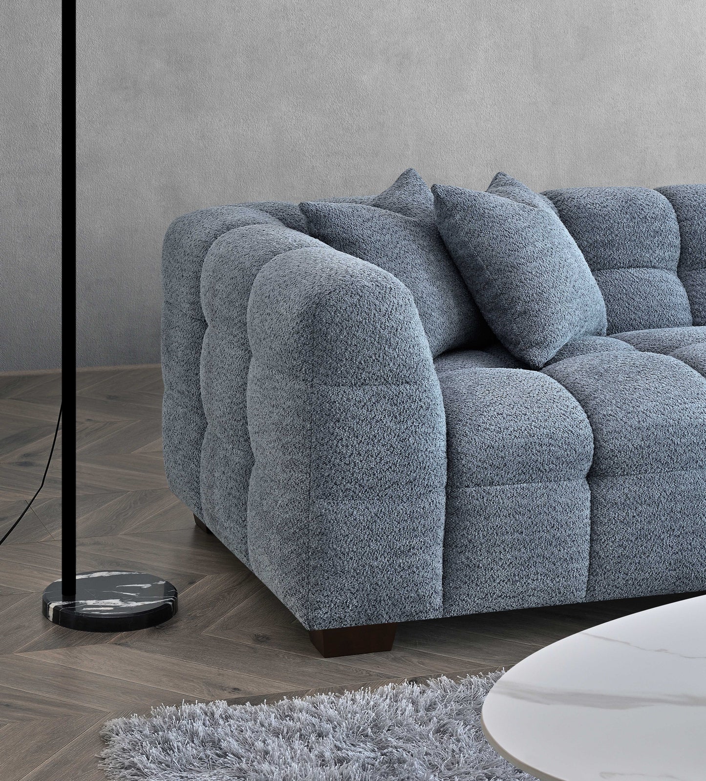 Shop the Tribeca Corner Sofa, featuring deep channel stitching and upholstered in a stunning iron boucle fabric. A modern twist on the classic Chesterfield design. Shop online today at www.nobleandnook.co.uk