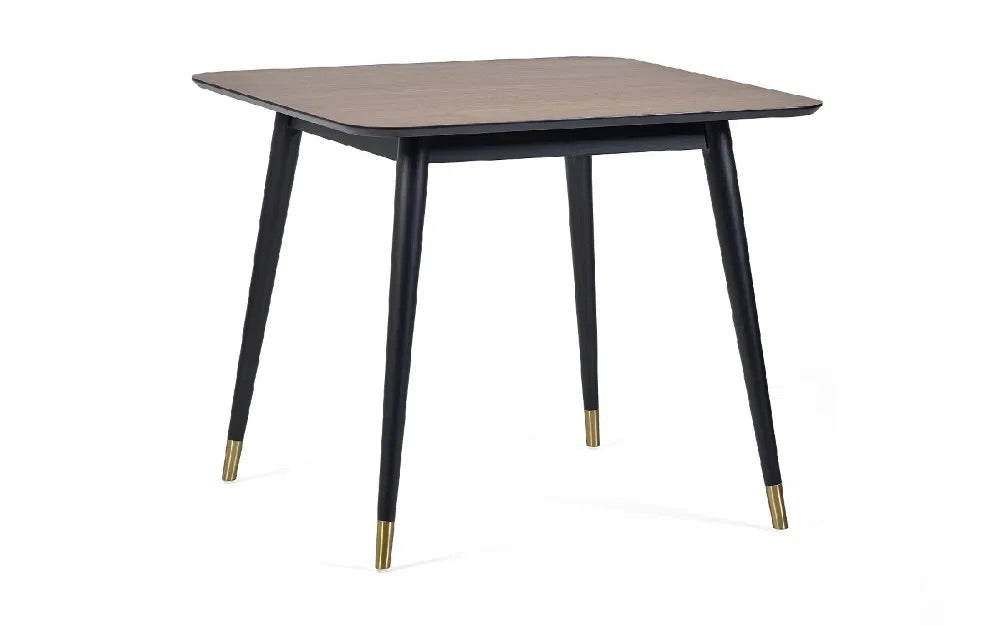 Retro-Inspired Design, combined with mid-century style with modern detailing for a timeless dining centrepiece. Walnut Finish with Brass-Tipped Black Legs. H75xL90xW90cm. www.nobleandnook.co.uk